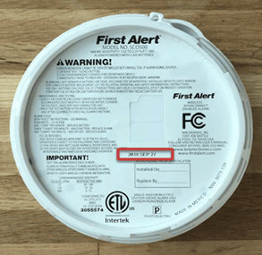The back of a First Alert CO detector showing the expiration date.